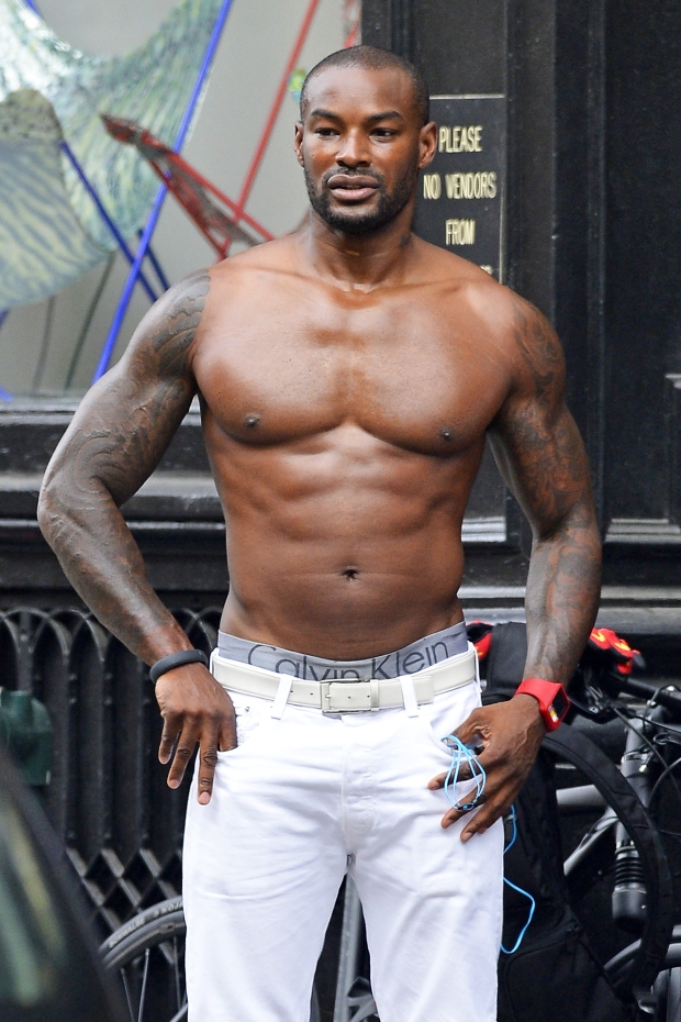 EXCLUSIVE** Tyson Beckford takes off his shirt while walking in the scorchi...